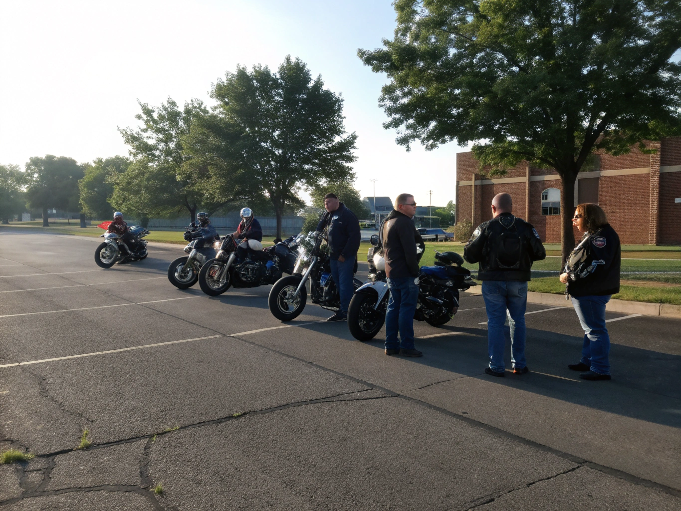 Group of riders laughing and sharing stories before a charity run
